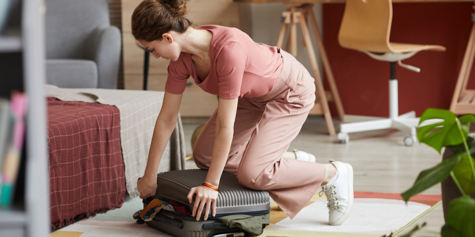 woman packing suitcase